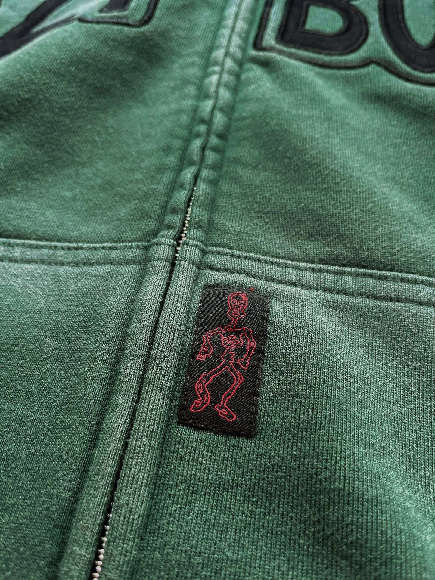 warped logo zip-up